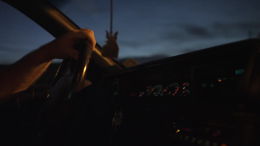 Man driving car during the evening