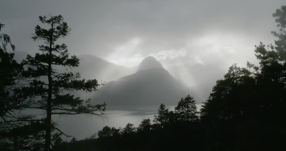 A storm moves across a lake