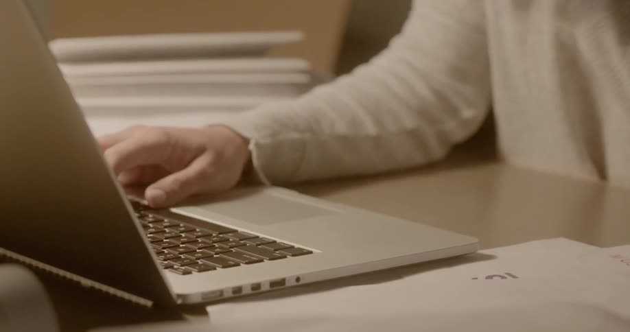 A woman works on a computer