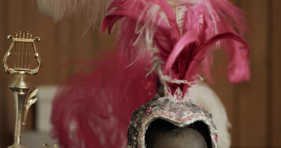A statue holds headgear