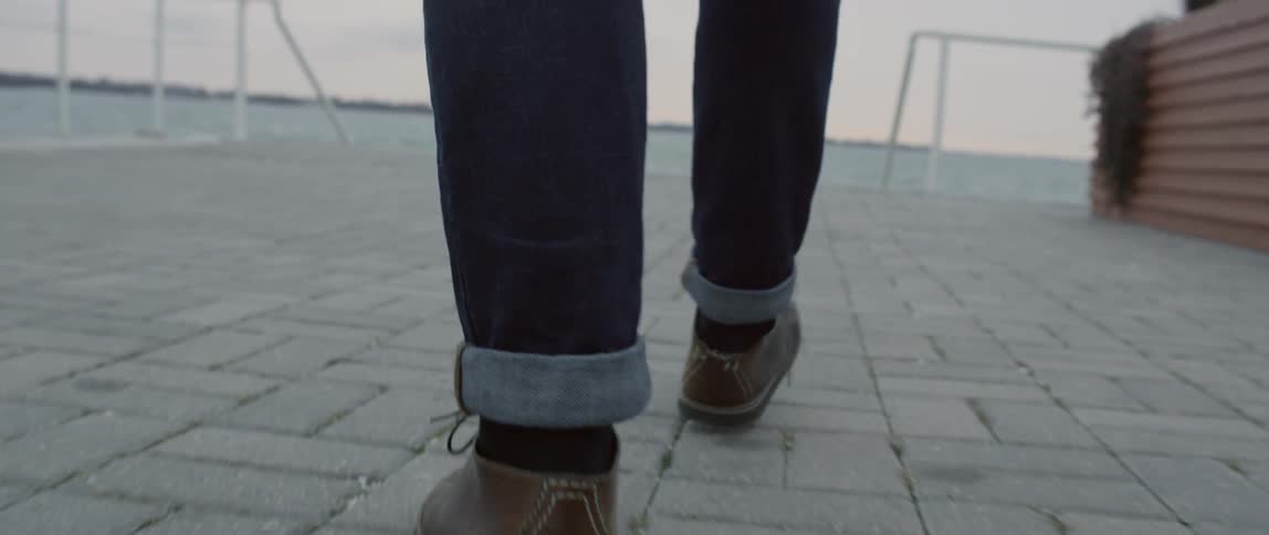 A person walks on bricks
