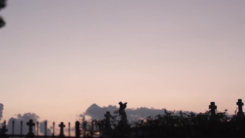Driving past a cemetery in the morning