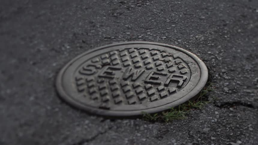 A manhole cover on the street