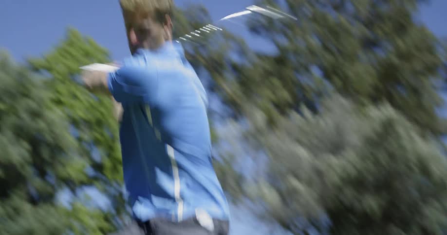 A man hitting a golf ball