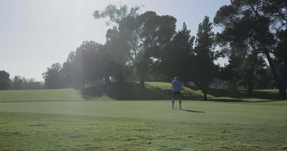 A man puts on a golf course