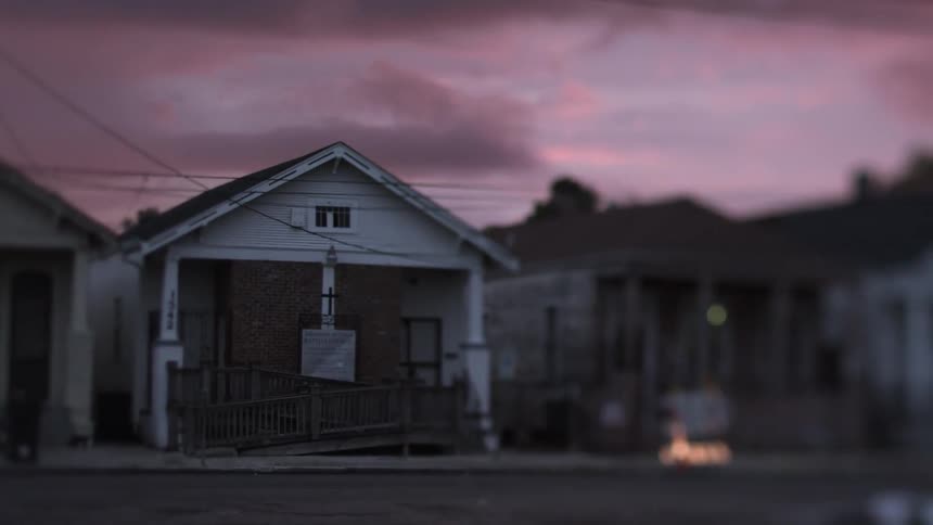 Purple sky over dilapidated houses