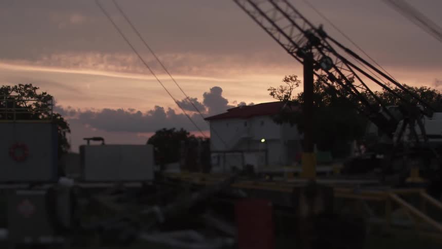 Cranes sitting in an industrial area