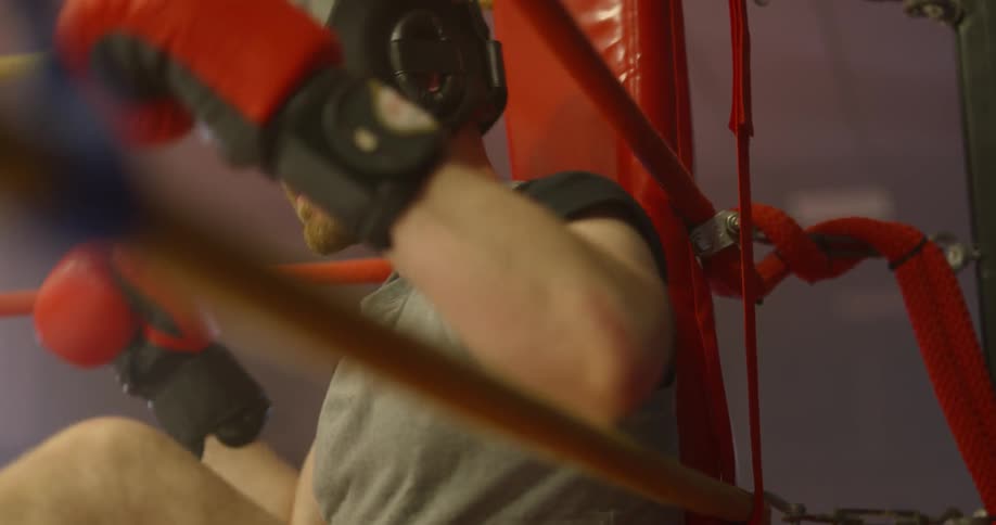 A man stands up in the ring