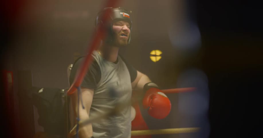Two men are in a boxing ring together