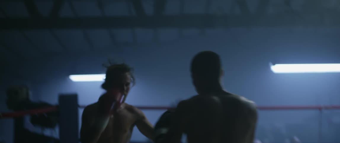Boxers fighting in a ring