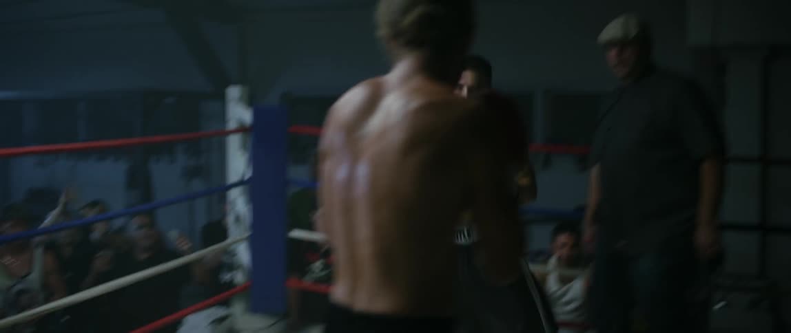 Two boxers fighting in a ring