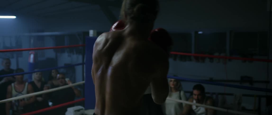 Two boxers fighting in a ring