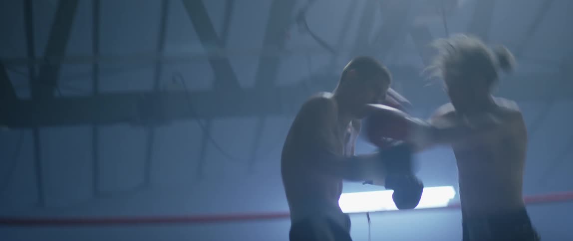 Two men boxing in a ring