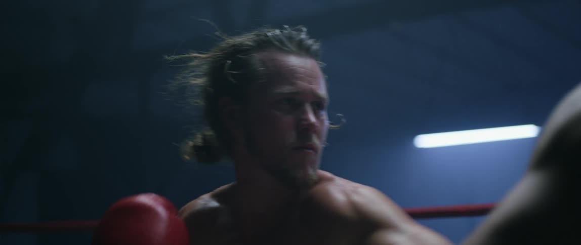 Two boxers fighting in a ring