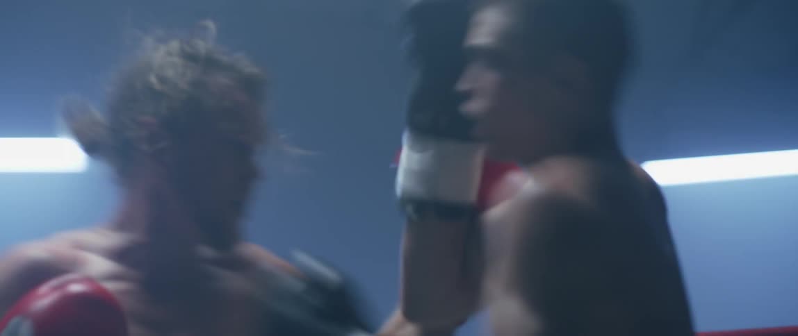 Two boxers punching each other in the ring