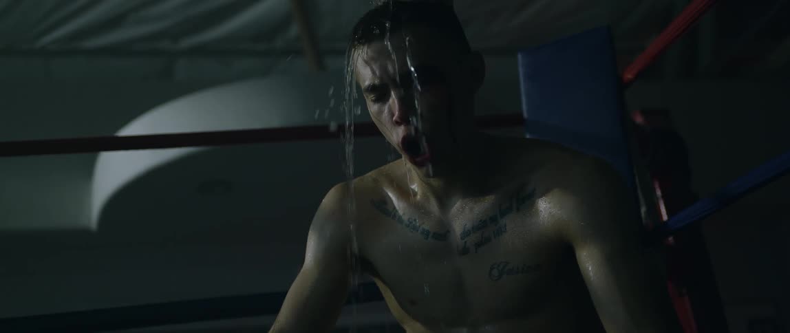 Water is poured onto an exhausted boxer