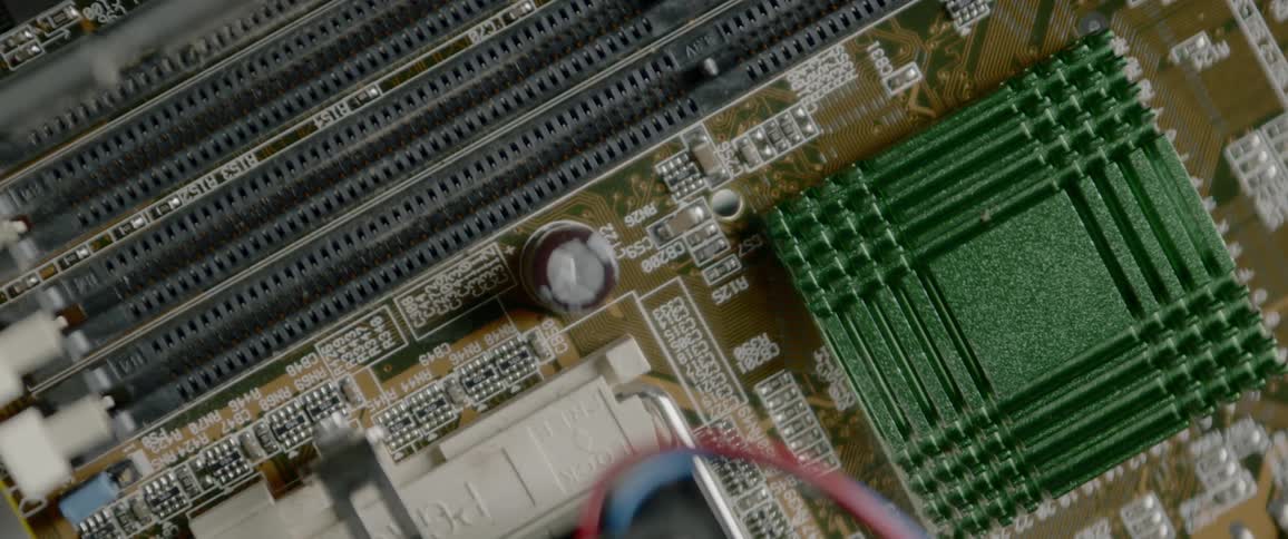 A circuit board lightly illuminated with light emitting from its center