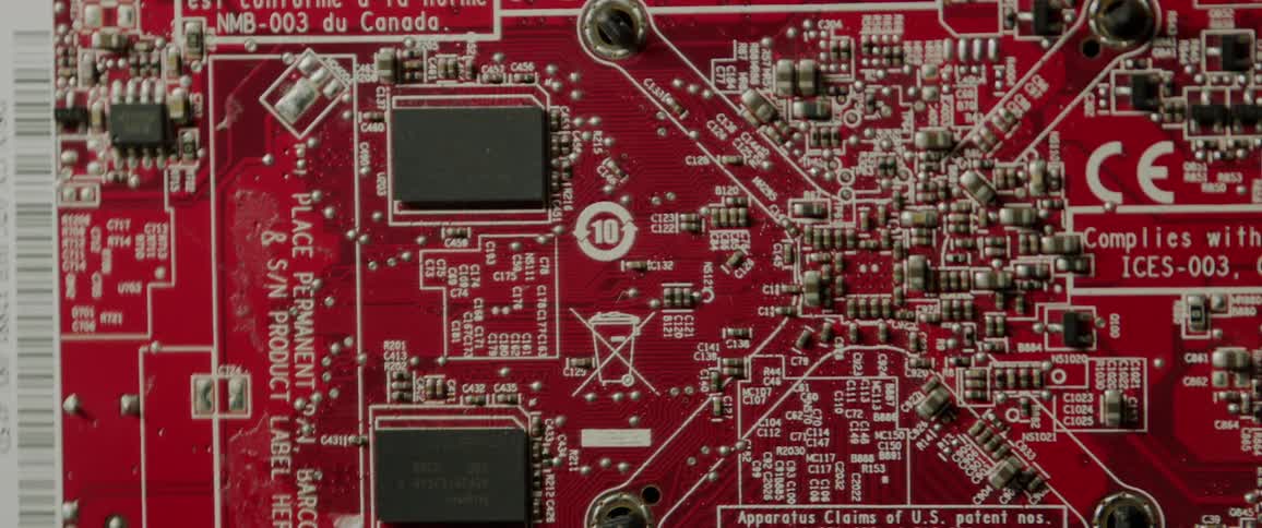 Close up of red circuit board under changing light conditions