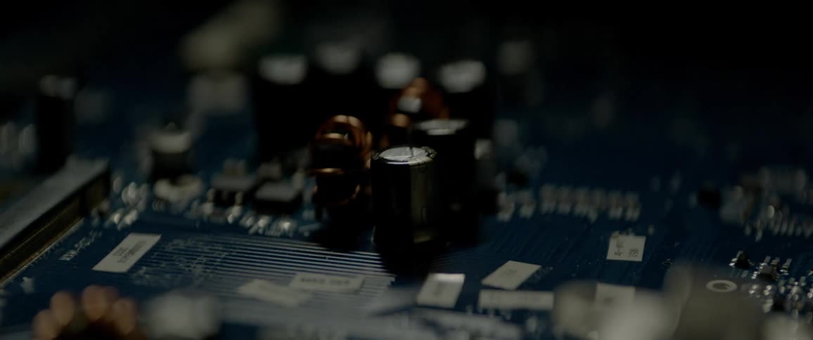 The light shines on the computer board transistors