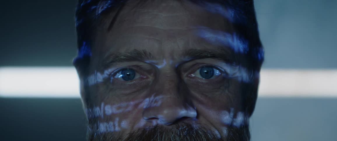 A man has words projected onto him
