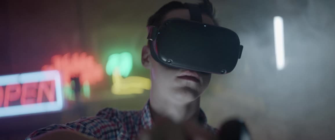 A man using a virtual reality headset in a bar