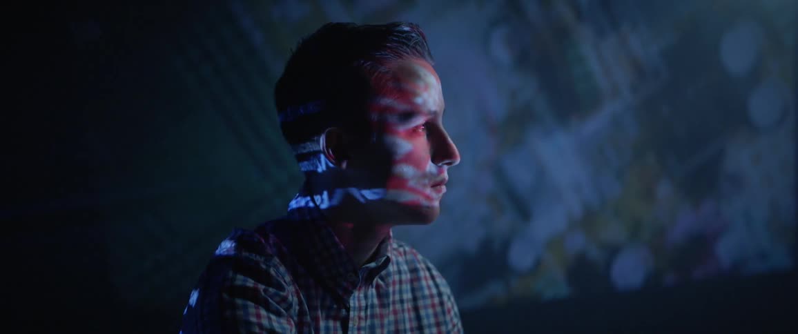 A man stares into the projector