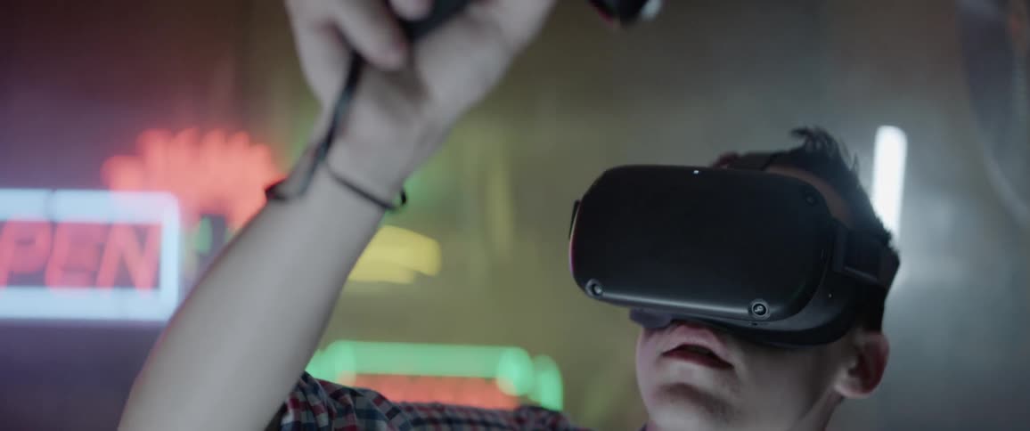 Young boy playing a virtual game indoors
