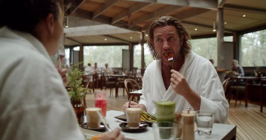 A couple eat at a restaurant