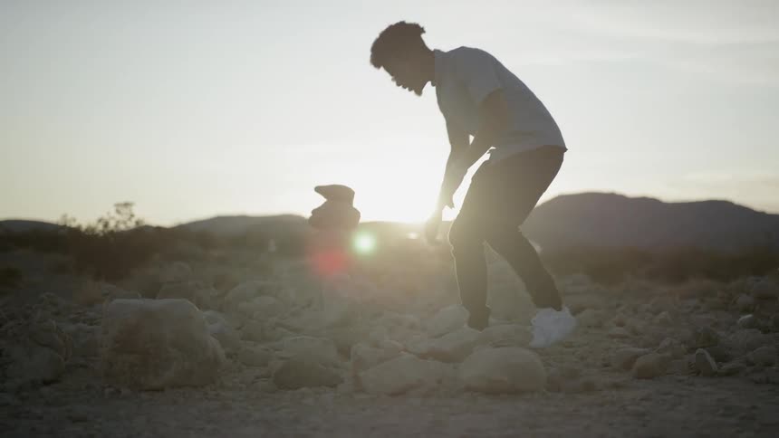 A man walking on rocks
