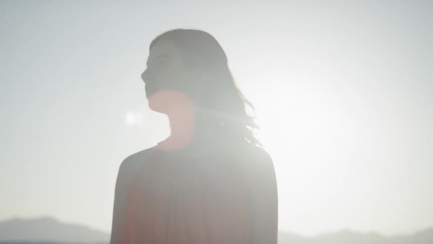 Female standing in the desert