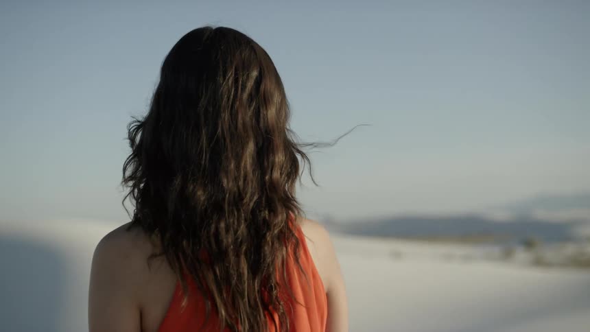 Girl standing in the desert