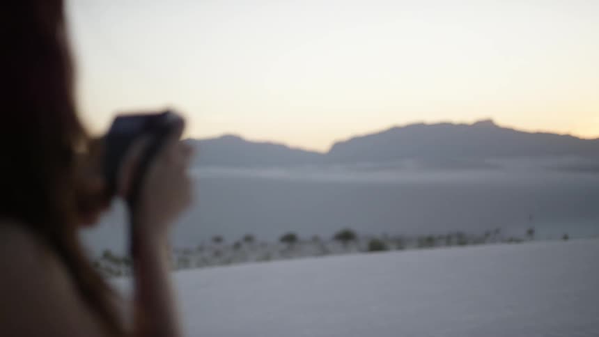 A woman using a camera