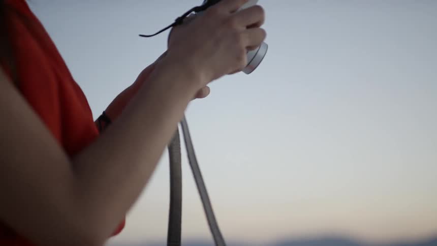 A woman using a camera