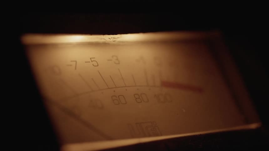 A sound meter moves back and forth