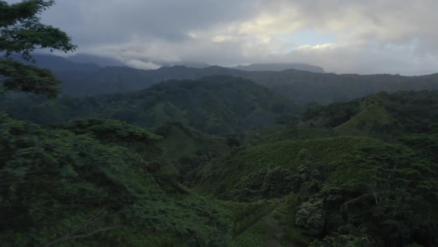 An aerial view of a mountain landscape on a cloudy day