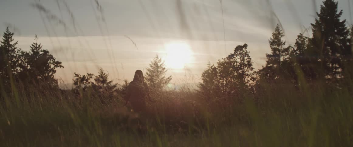 A woman in a field outdoors