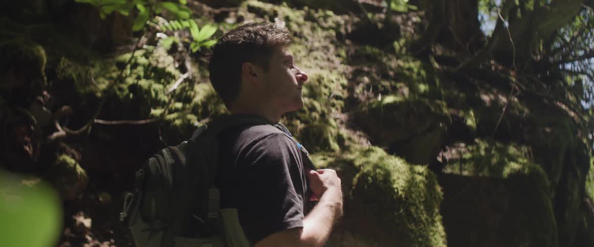 A man is hiking in the wilderness