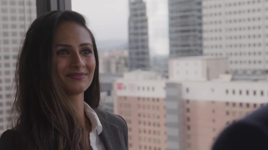 A woman nodding a smiling