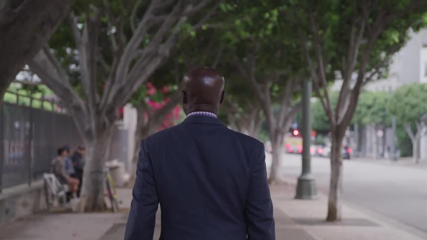 A man is walking down the street