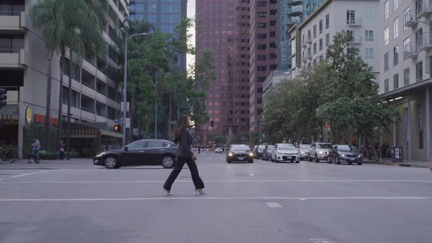 People walk across the road