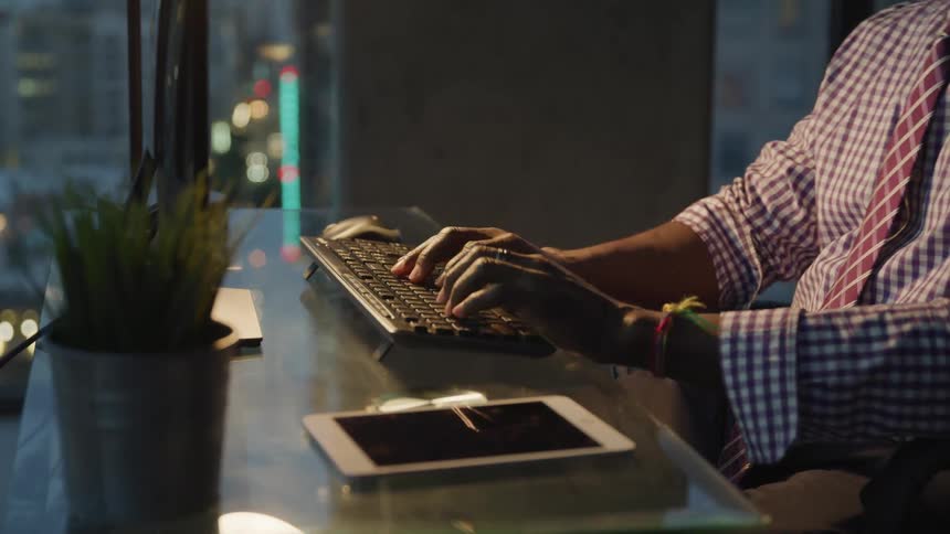 Worker typing on the computer keyboard