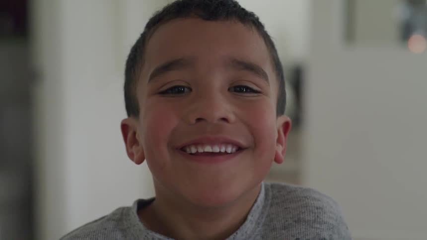 A young boy smiles