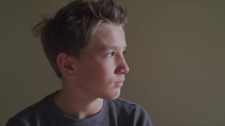 A teenager looking to the right
