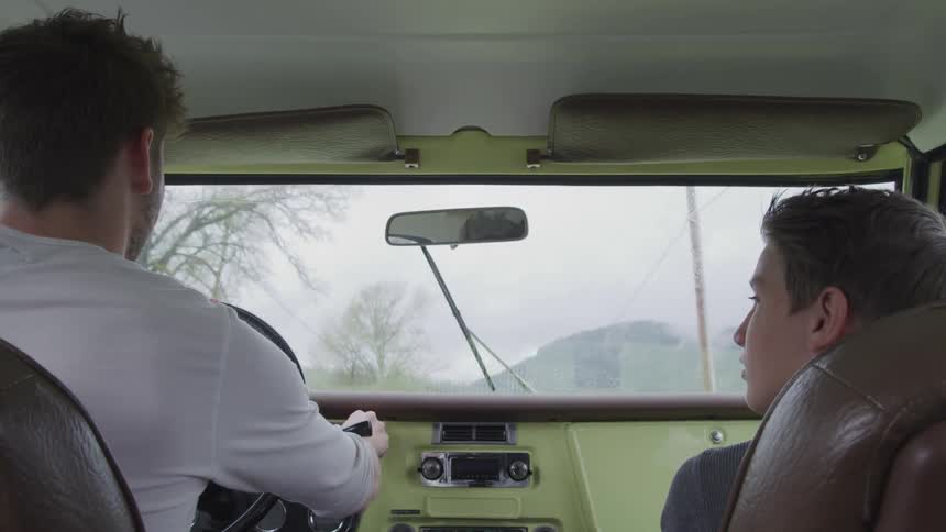 Two men in a vehicle