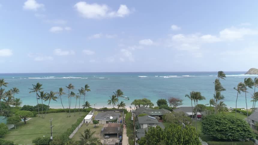 Landscape view of homes overlooking the beach and water