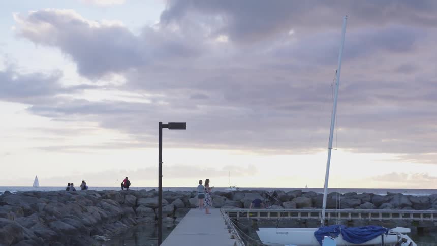 People by rocks at a beach
