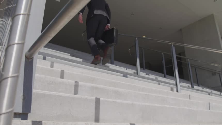 A man walks up the stairs
