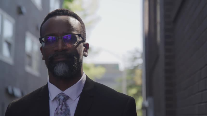 A black man staring at the camera