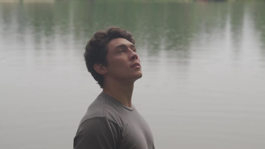 A man contemplatively thinking