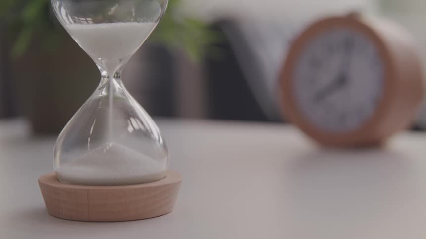 An hourglass and a clock